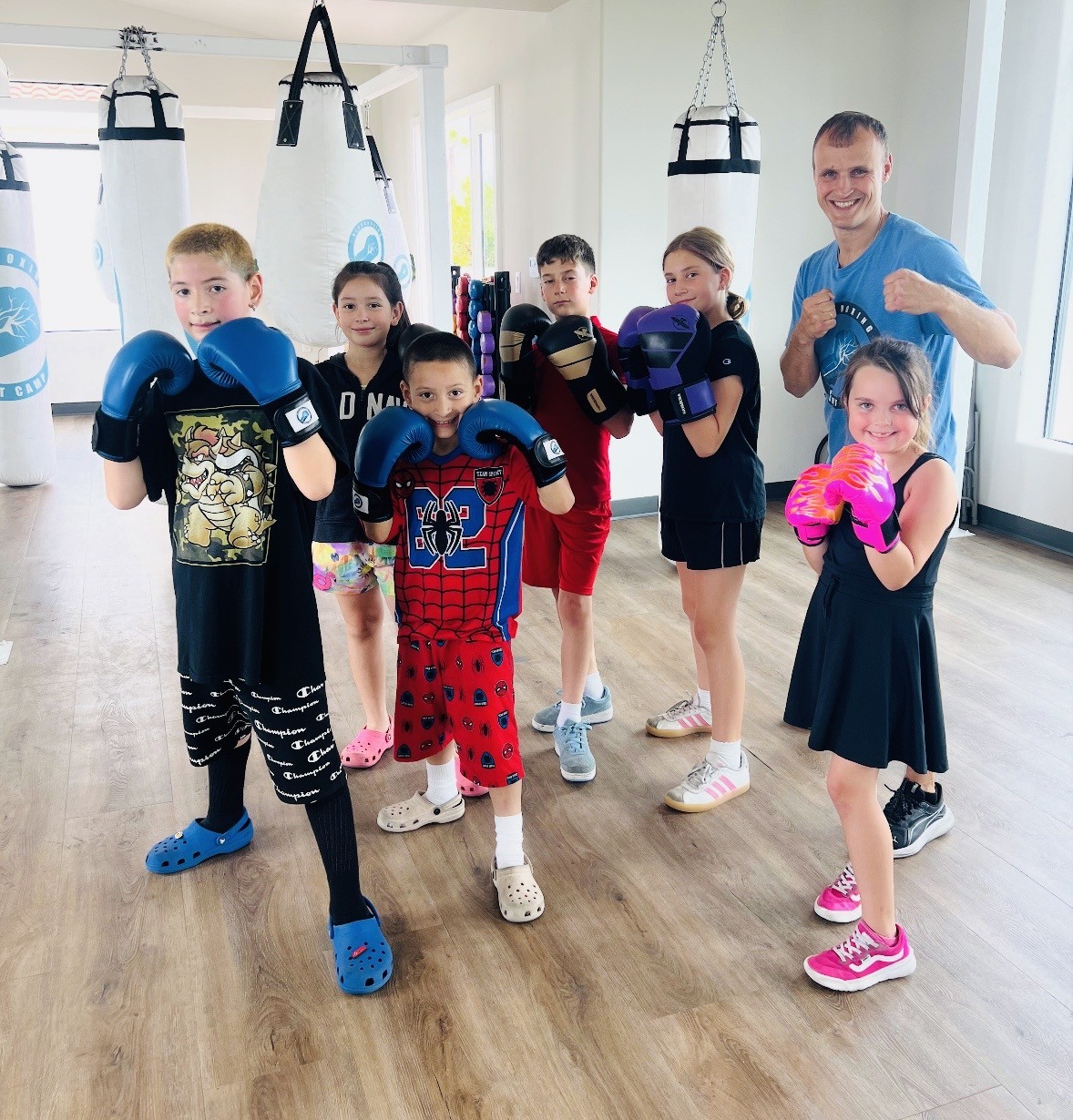 Kids and teens boxing class with Coach Evgeny at Portside Fitness.