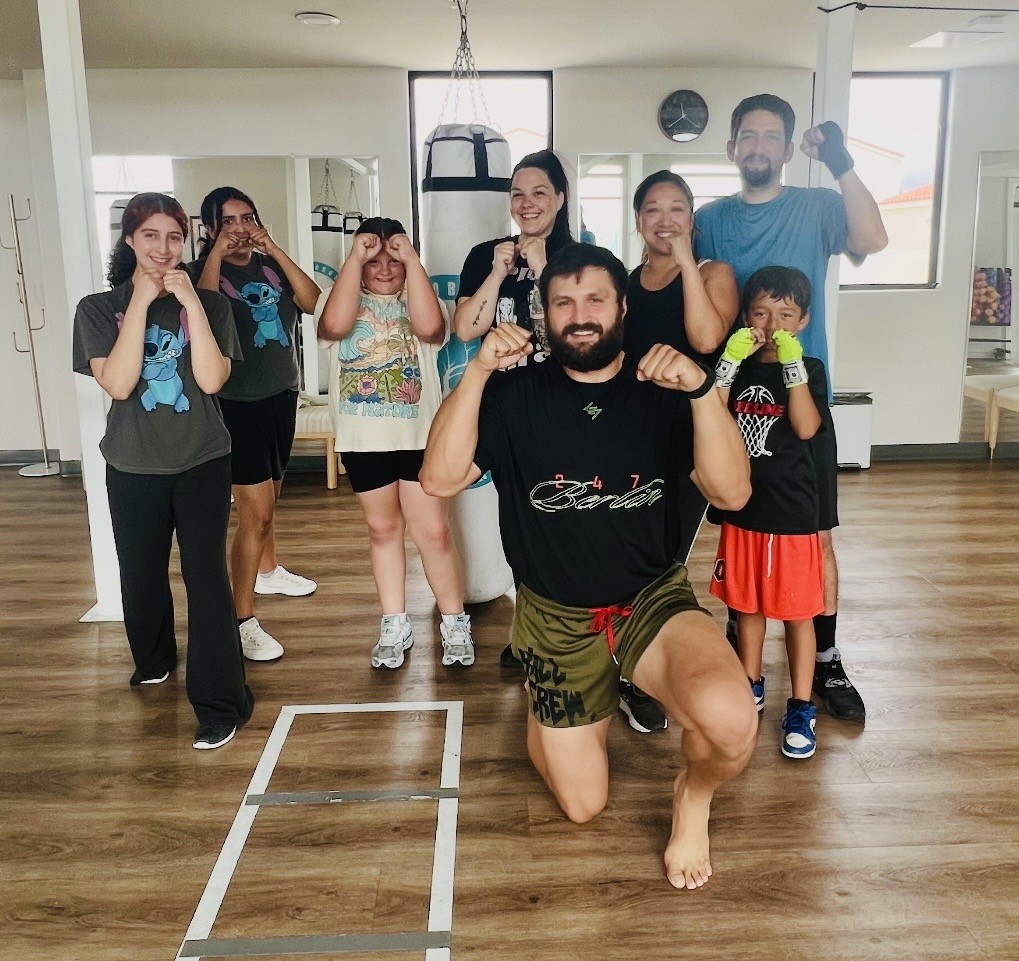 Family kickboxing class group at Portside Fitness.